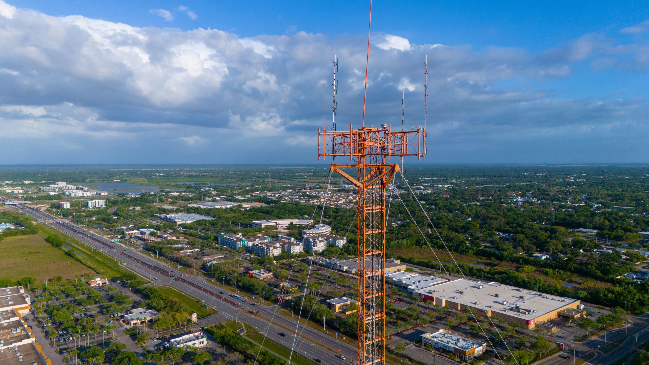 Picture of top of radio tower overlooking a city.